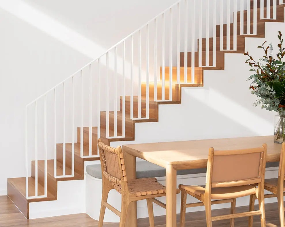 Aire timber Dining table and chairs in Dining room next to a staircase