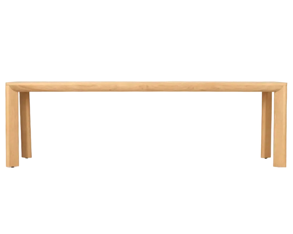 A minimalist light oak wood dining table with a thick rectangular top and blocky, tapered legs, shown against a solid white background.