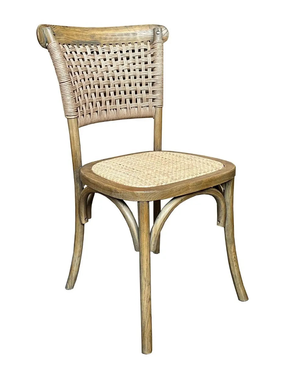 A woven rattan rush seat on a bentwood dining chair
