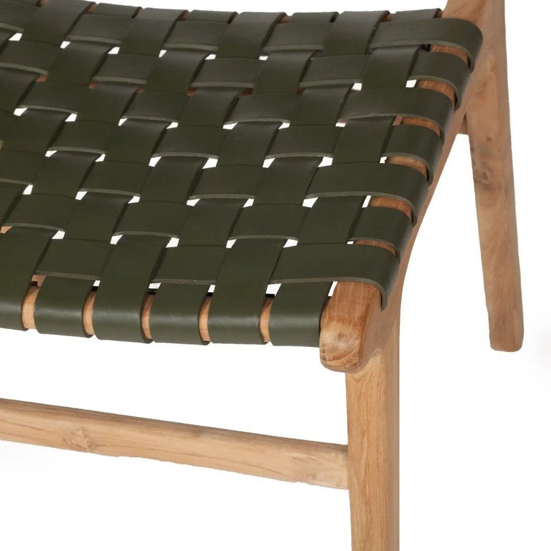 A contemporary Luca Woven Leather Dining Chair with a solid teak frame and olive dyed leather, showing a close up pf the leather mesh seat
