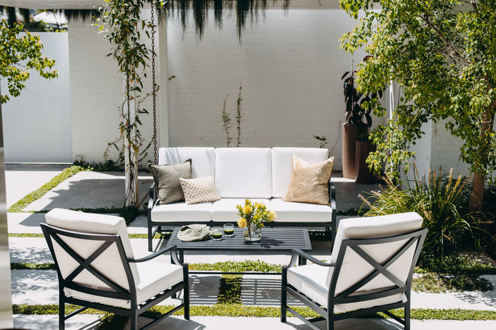 Portofino Lounge Set in Black styled in the sun front on angle.