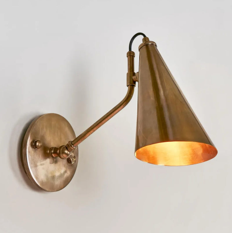 Lumen Sconce in Antique Brass