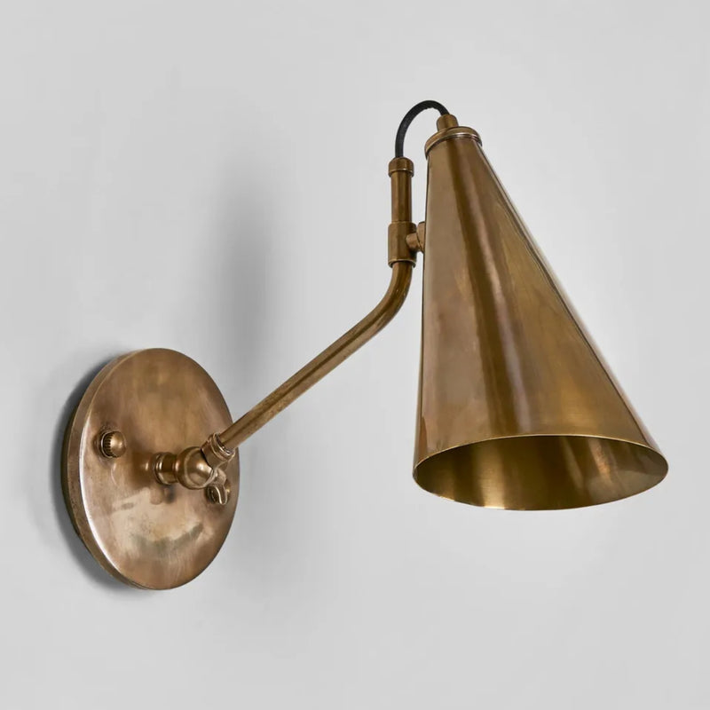 Lumen Sconce in Antique Brass