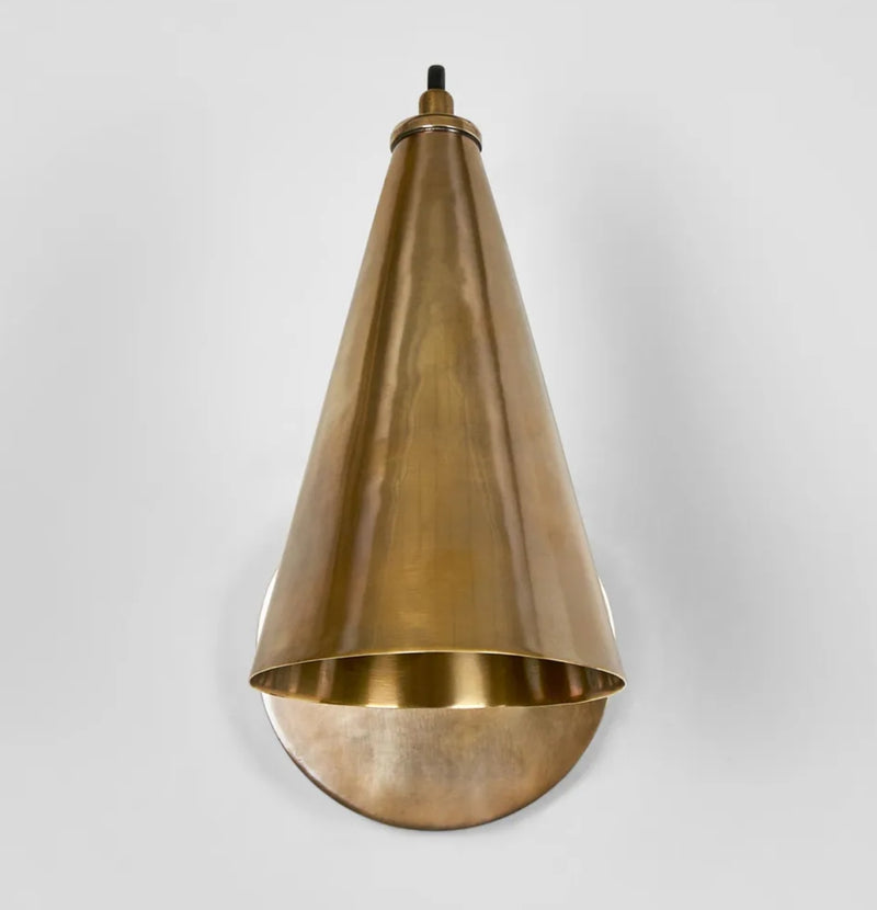 Lumen Sconce in Antique Brass