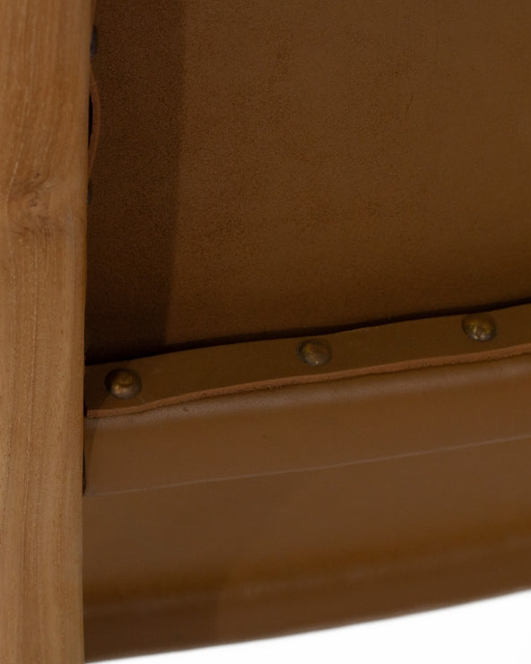 A contemporary Sutton Leather Dining Chair with a teak wooden frame, and brown leather upholstery.