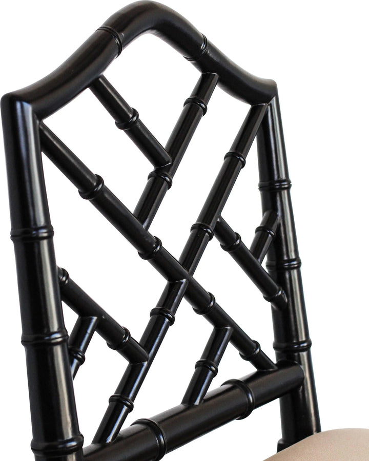 A contemporary Chippendale Bar Counter stool with a solid mahogany frame painted in black and tan upholstered seat, showing a side profile against a white background.