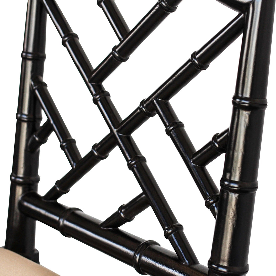 A contemporary Chippendale Bar Counter stool with a solid mahogany frame painted in black and tan upholstered seat, showing a side profile against a white background.