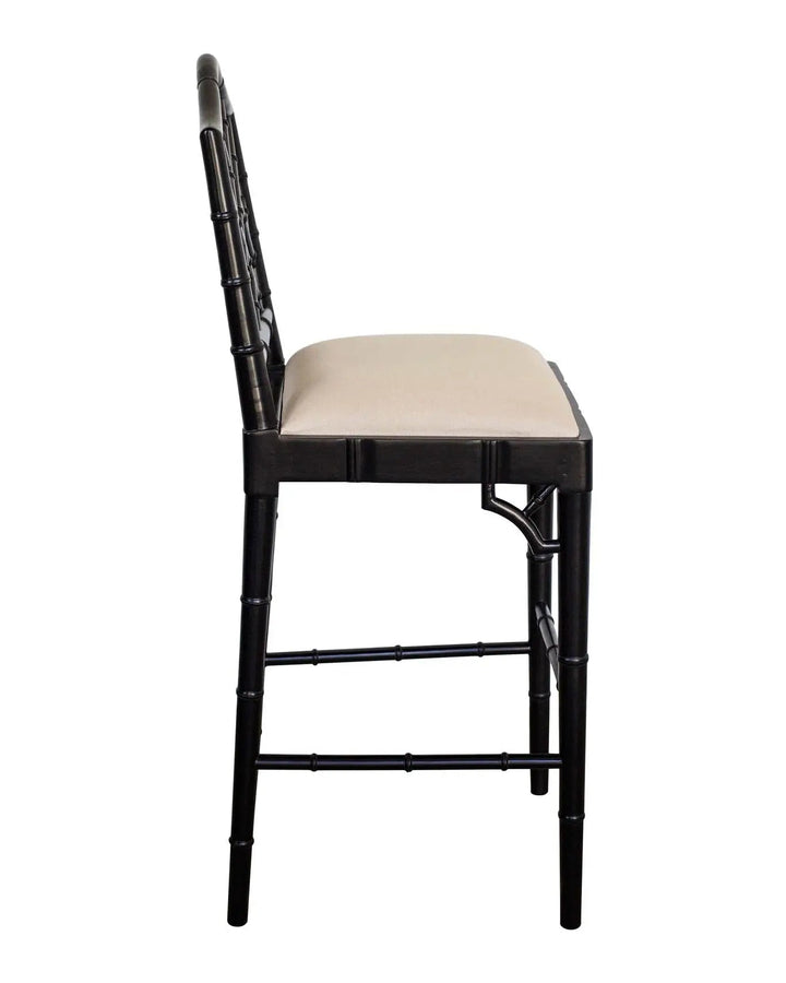 A contemporary Chippendale Bar Counter stool with a solid mahogany frame painted in black and tan upholstered seat, showing a side profile against a white background.