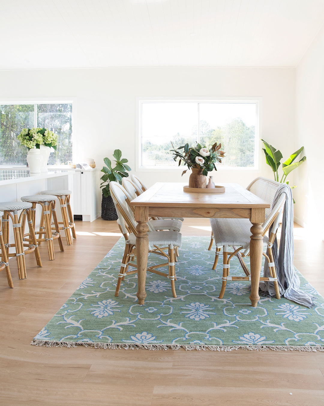 Side profile of English Farmhouse Dining Table in a dining room. 